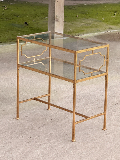 Uttermost Genell gold two-tier glass side table, three-quarter view