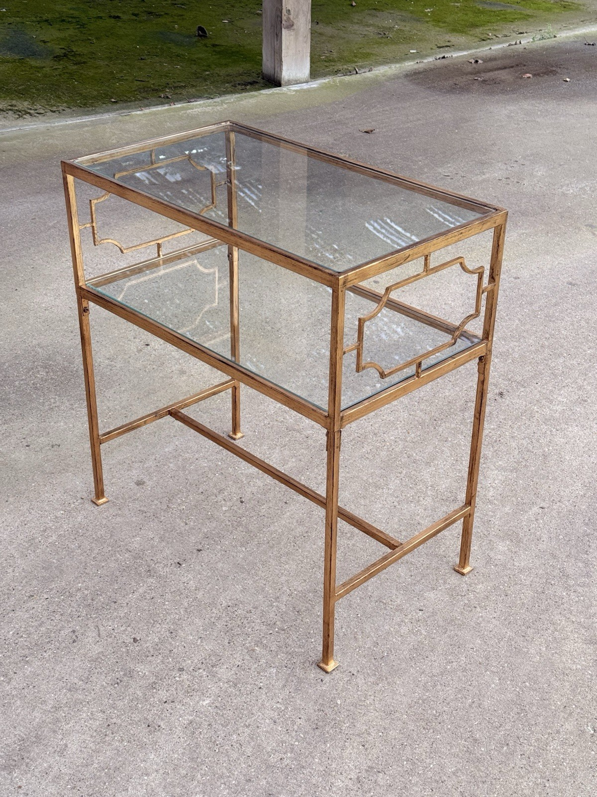 Uttermost Genell gold two-tier glass side table, corner view