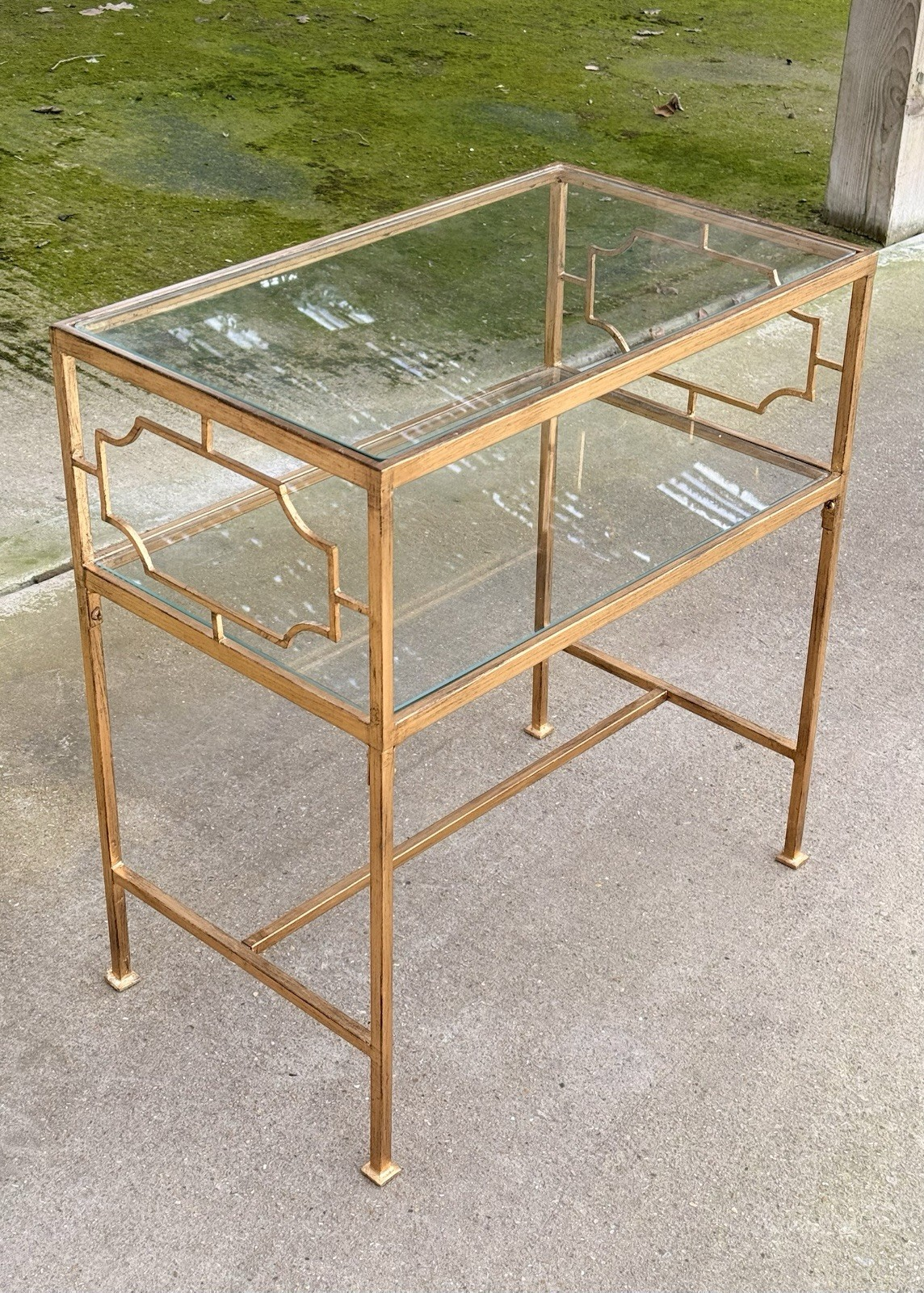 Uttermost Genell side table, gilded metal frame with Greek key style fretwork and two glass tiers