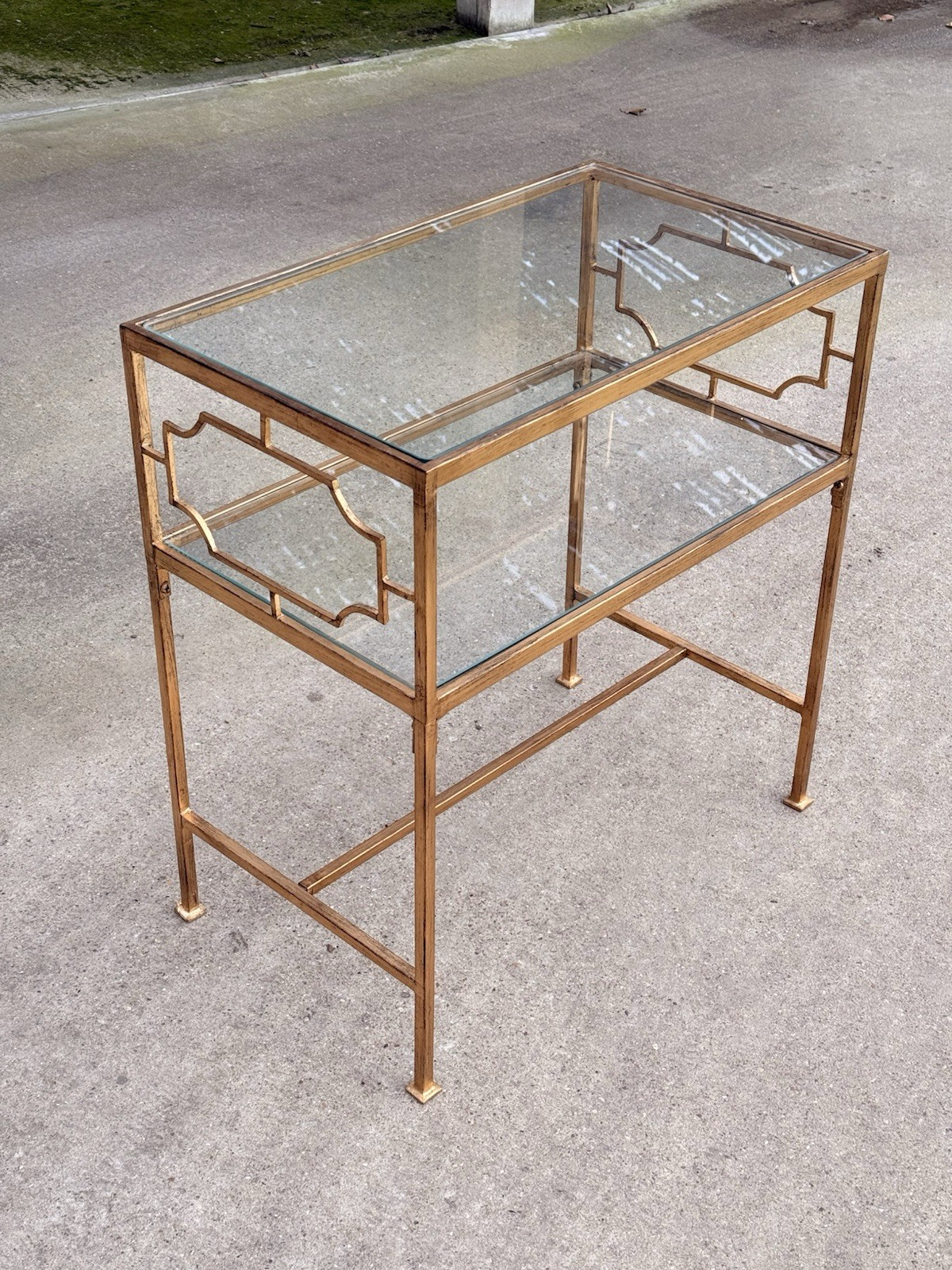 Uttermost Genell gold two-tier glass side table, angled view from above