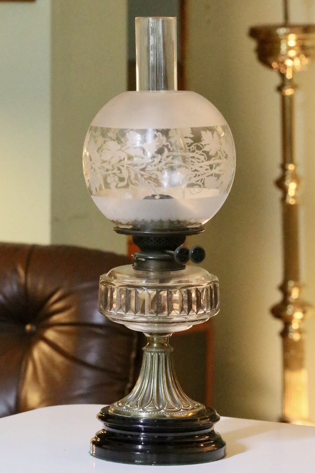 Victorian Art Nouveau brass oil lamp with crystal glass reservoir, front view