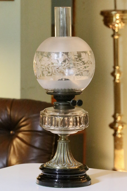 Victorian Art Nouveau brass oil lamp with crystal glass reservoir, front view