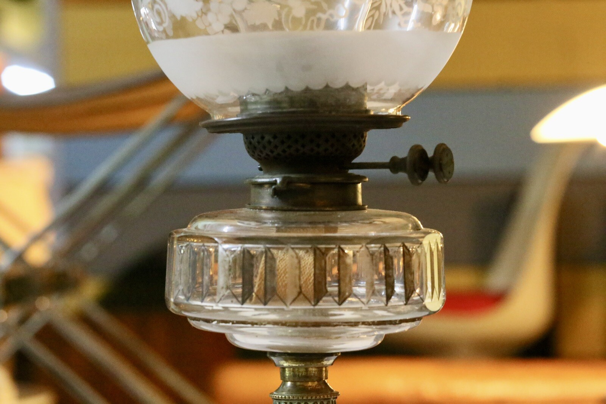 Close-up of burner, wick winder and glass reservoir