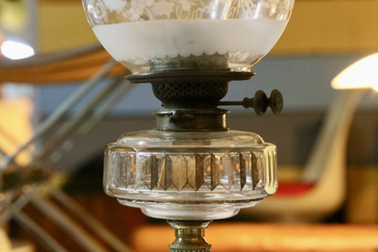 Close-up of burner, wick winder and glass reservoir