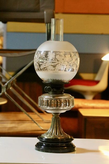 Victorian Art Nouveau brass oil lamp with crystal glass reservoir, side view