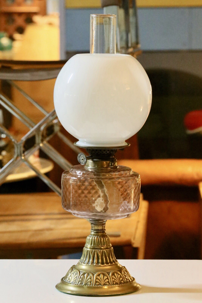 Victorian Art Nouveau brass oil lamp with pink glass reservoir, side view