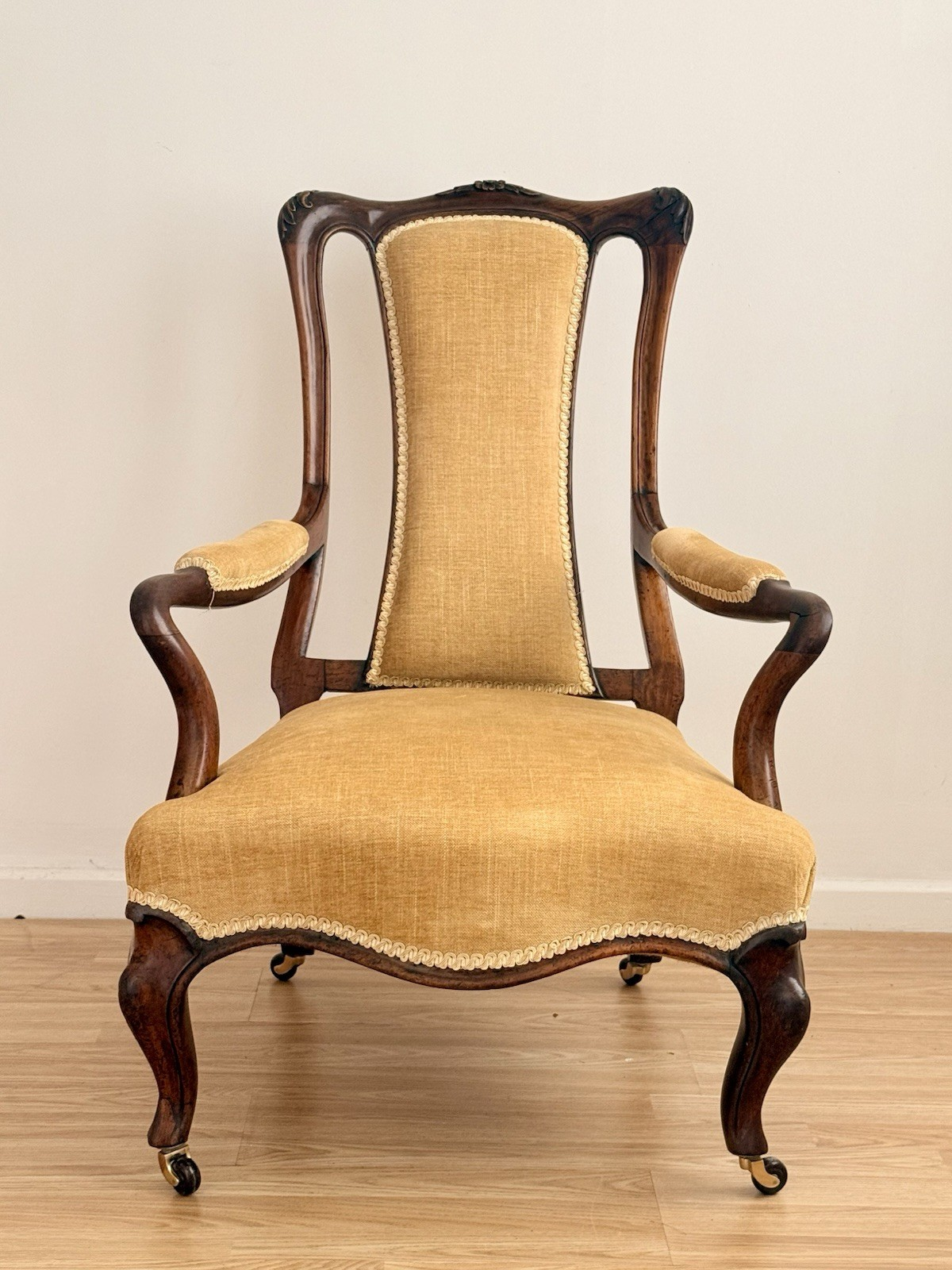Victorian carved rosewood lounge armchair, front view