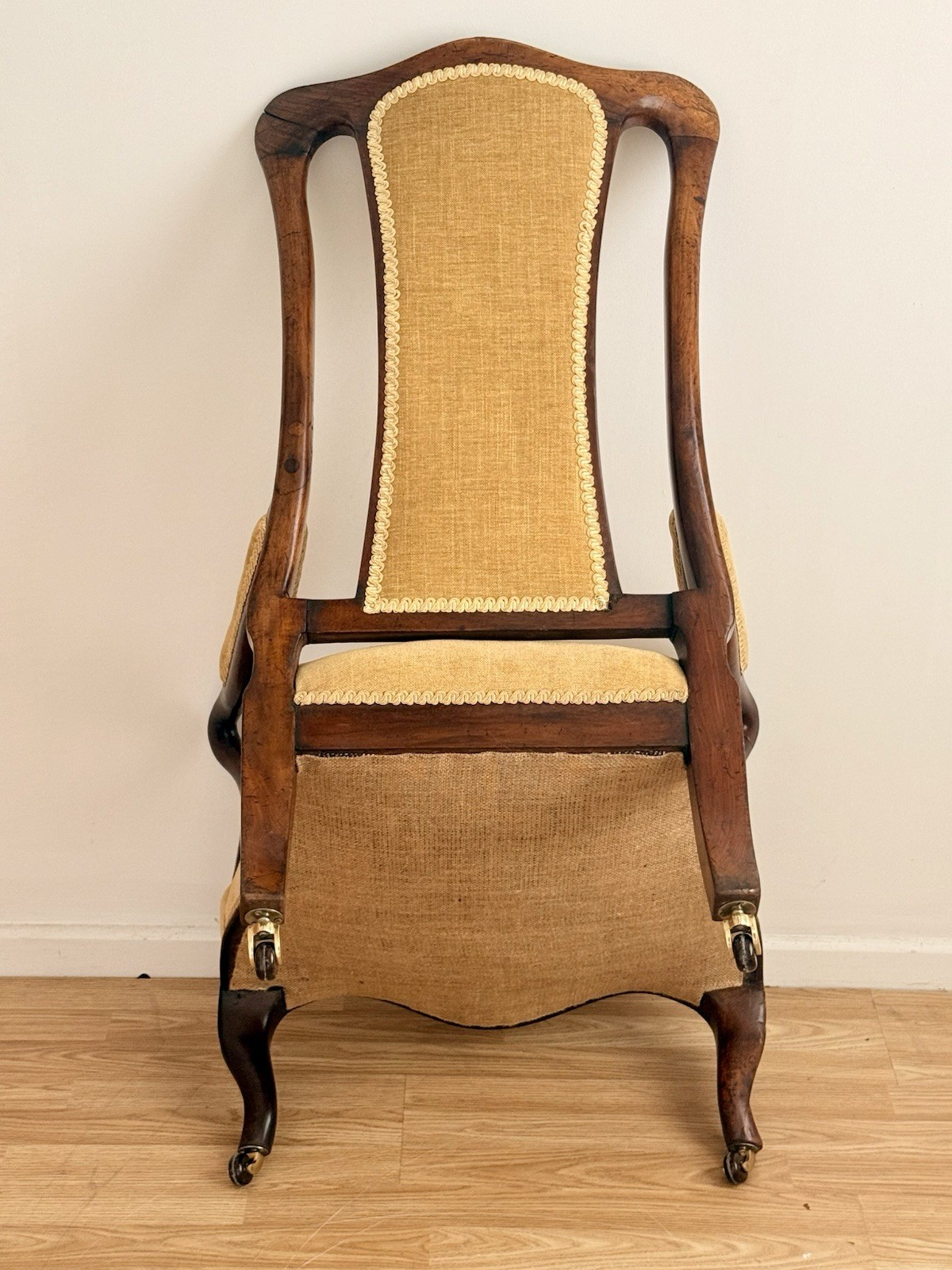 Underside view of the Victorian carved rosewood lounge armchair