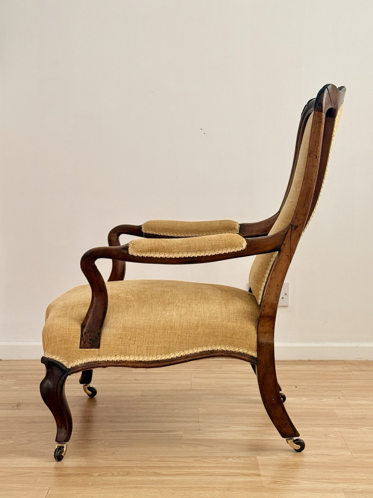 Victorian carved rosewood lounge armchair, side view from the right