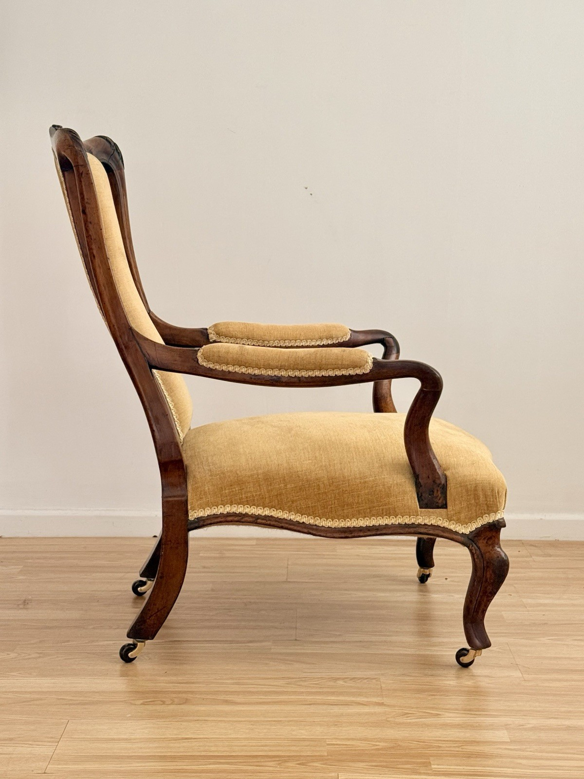 Victorian carved rosewood lounge armchair, side profile