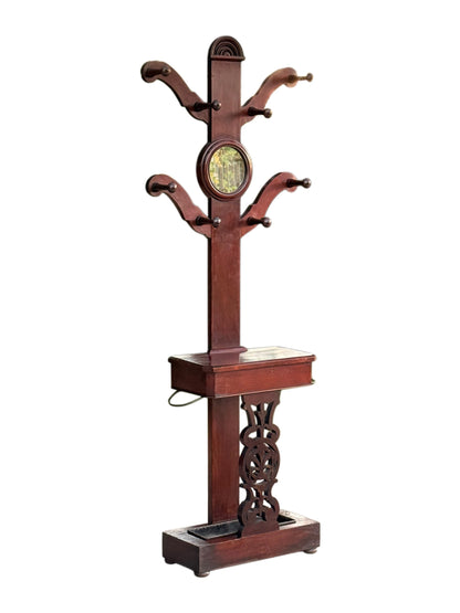 Victorian mahogany hall stand coat tree with circular mirror, glove box and umbrella stand, three-quarter view