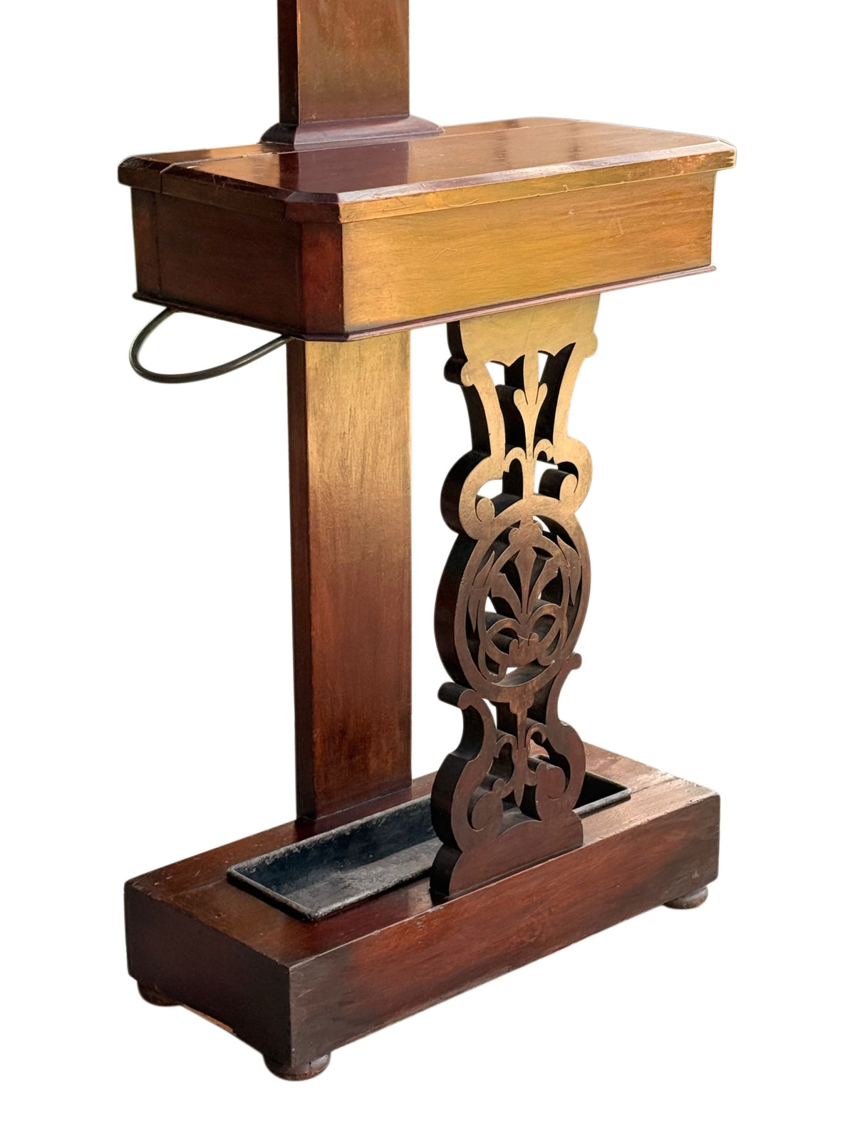 Hinged glove box, walking stick rests, pierced fretwork panel and zinc drip tray of the Victorian hall stand