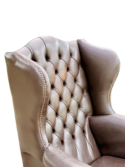 Close-up of deep buttoned brown leather back and wing