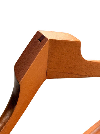 Close-up of the valet stand coat hanger shoulder showing grain and wear